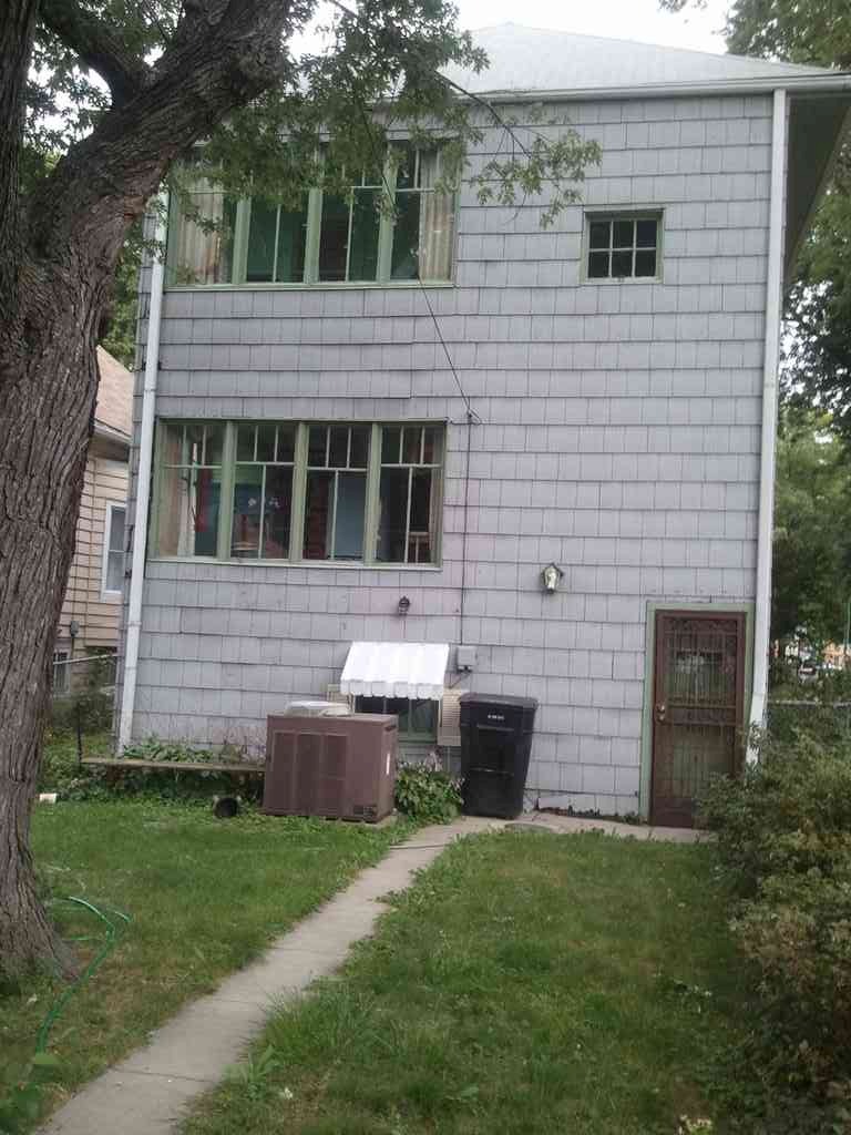 The back of Uncle Eddy's house. The house is believed to have been built in 1911 and has been in the family since it was built. Notice the light fixture directly above the garbage can.