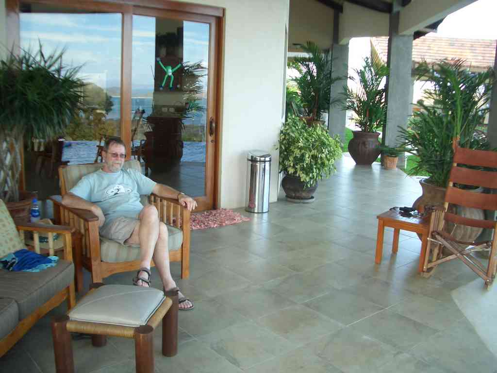 Jeff fully relaxing, occasionally looking up from his book to take in the scenery (or take a sip of his drink!).