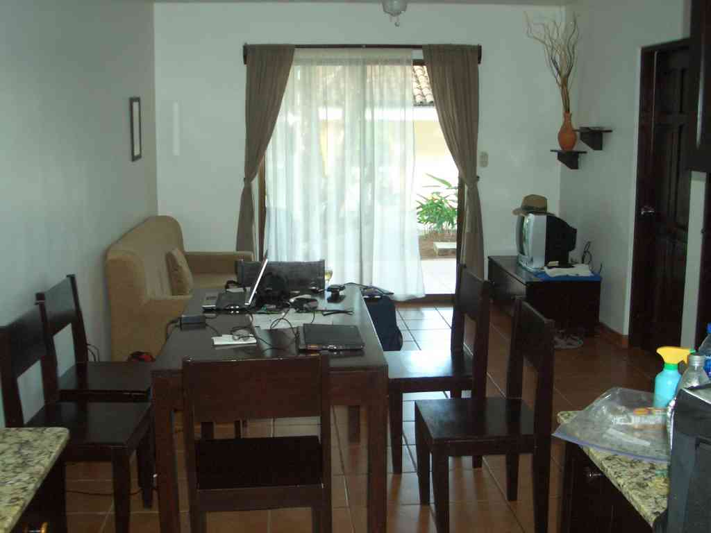 Looking out from the kitchen across the dining and living rooms.