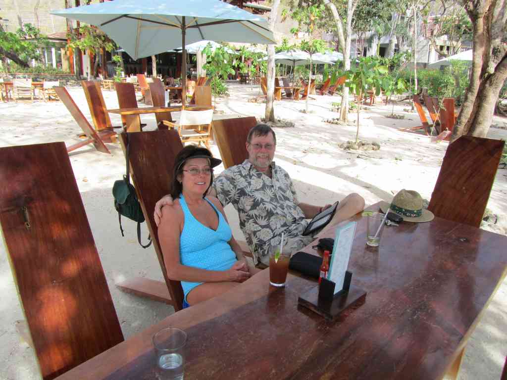 Dee Dee and Jeff at our table on the beach after devouring an amazing lunch!