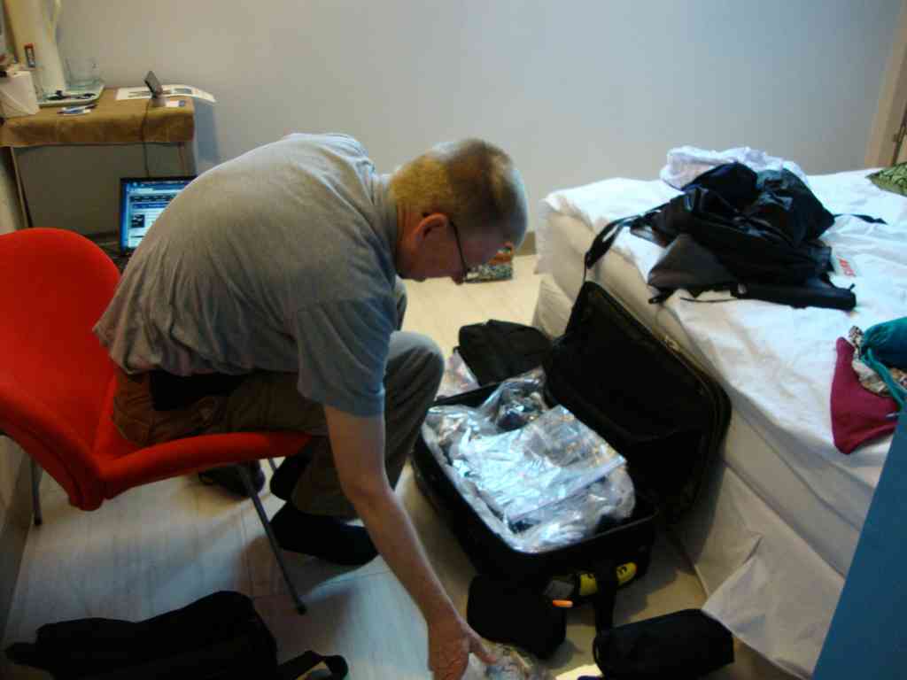 Here is Charles digging through his suitcase, which doubled as his 'dresser' for the next 4.5 days! The only furniture was a small glass table and a chair, so we had to keep our suitcases closed just to maneuver around the room. We were very glad we packed light!