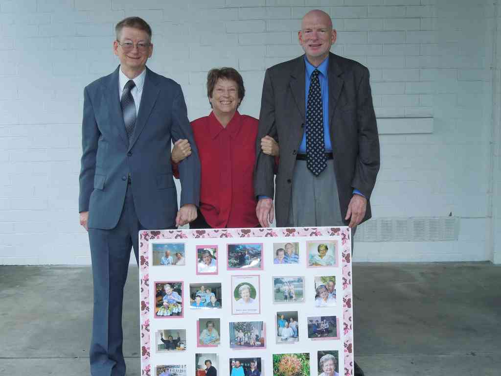 Charles (left), Helen, and Wayne with the beautiful photo collage Helen assembled. Everyone commented on what a wonderful job she did.