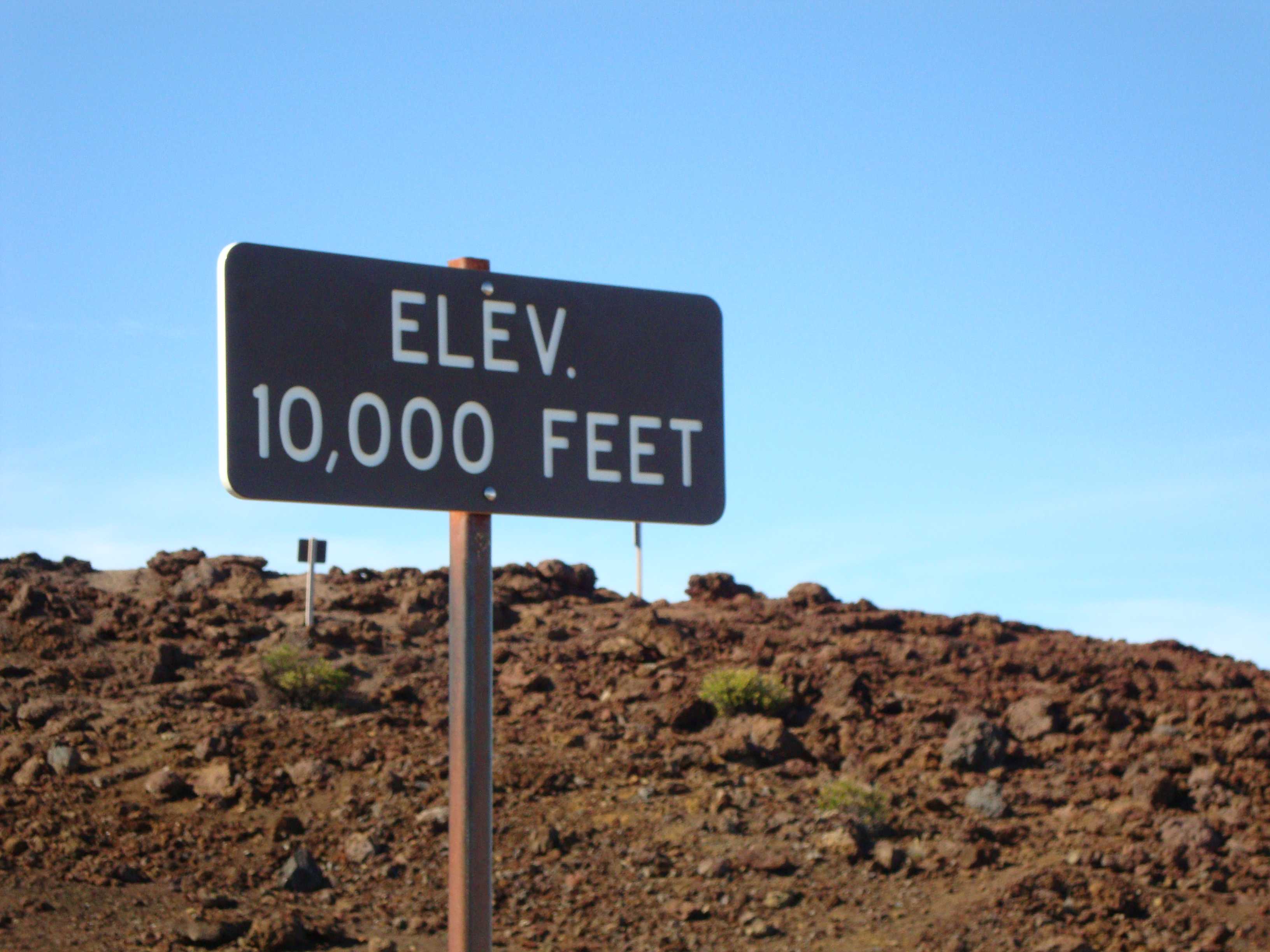 Haleakala is 10,000 feet high at the upper parking lot. We then climbed up to the observation deck which sits at 10,023 feet (3,055 meters) above sea level! Fun fact: Haleakala is actually taller than Mount Everest if you measure from its base on the sea floor! Its total height is 29,703 feet, making it 675 feet taller than Everest.
