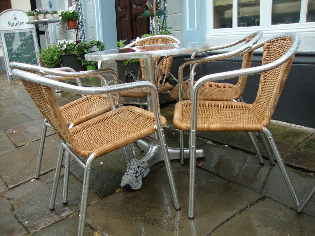 This restaurant cleverly solved the problem of rocking tables by putting little 'shoes' on the table feet to stabilize them!