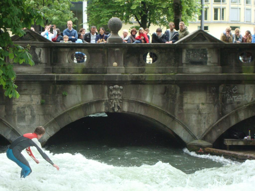 Spectators constantly line the bridge to watch the surfers in action.