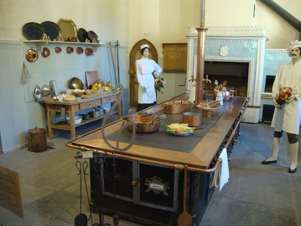 The left side of the kitchen.