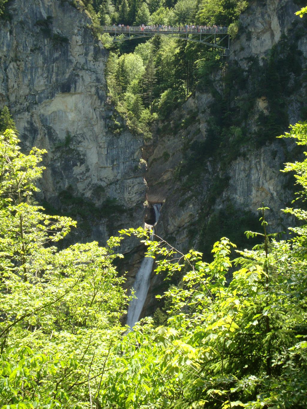 Looking out at Marienbr&uuml;cke (Mary's Bridge) spanning the gorge and waterfall! We wanted to hike up to it, but ran out of time. You can see the tiny crowds standing on it looking back at us!