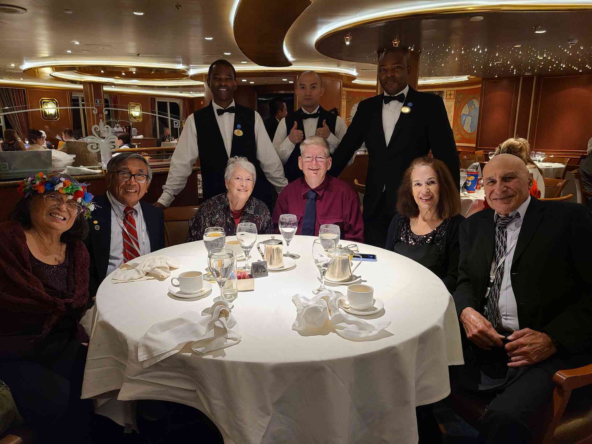'Our Gang' along with our amazing waiters, Nene (left) and Anesu (right). The waiter in the center giving two thumbs up was Rose and Ron's previous waiter, who still stopped by to say 'Hi' every night!