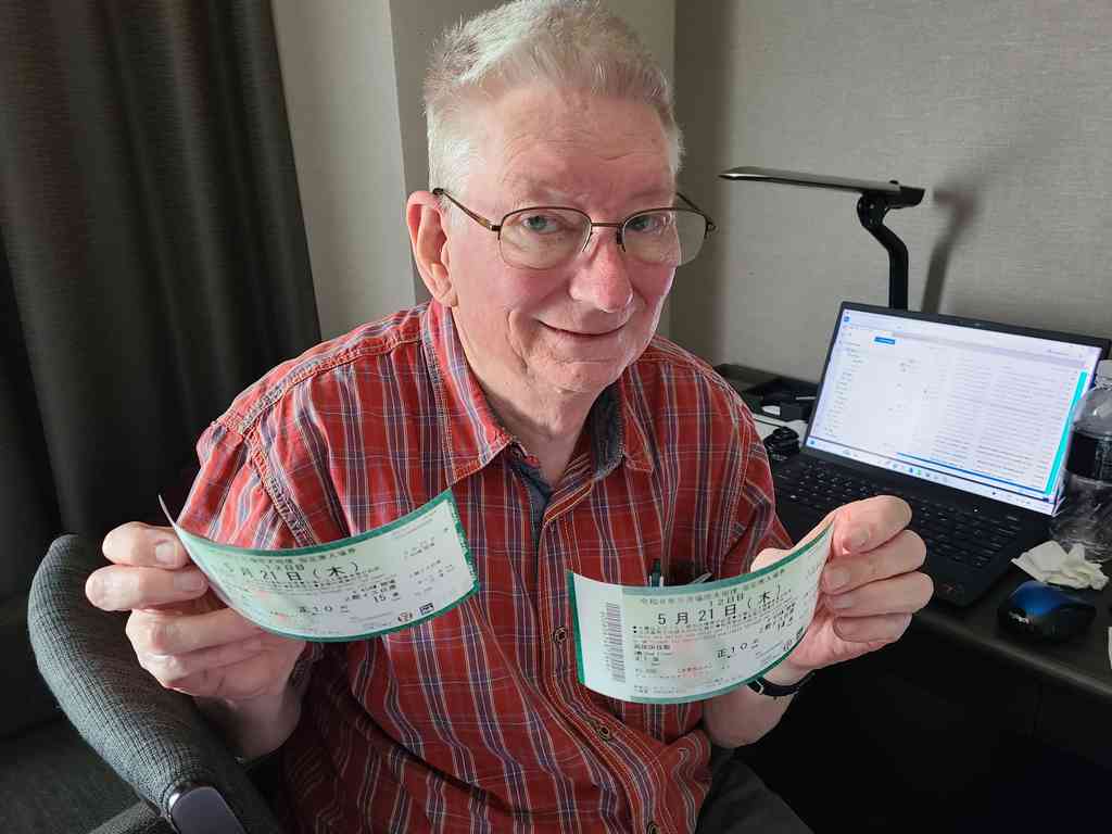 Charles looking extremely excited after successfully retrieving his tickets from 7-Eleven!