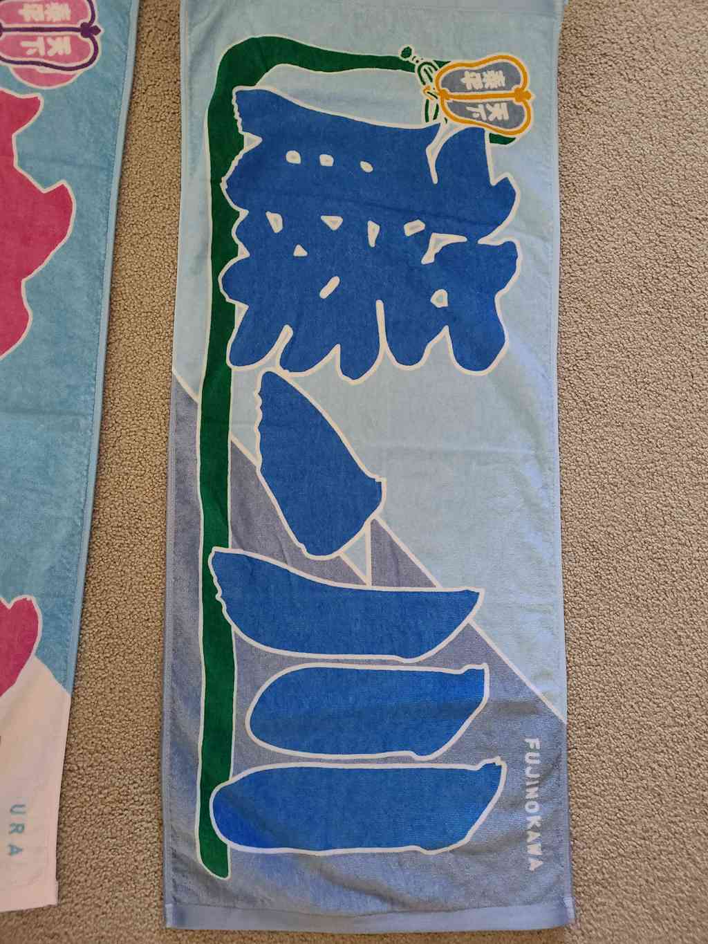 We had to buy some of these vibrant towel banners for our favorite wrestlers to wave fiercely during their bouts! This one is for Fujinokawa, a small, feisty wrestler rocketing up the ranks. He regularly takes down top-tier Yokozunas using brilliant throws and trips to defeat opponents who outweight him by 200 pounds!