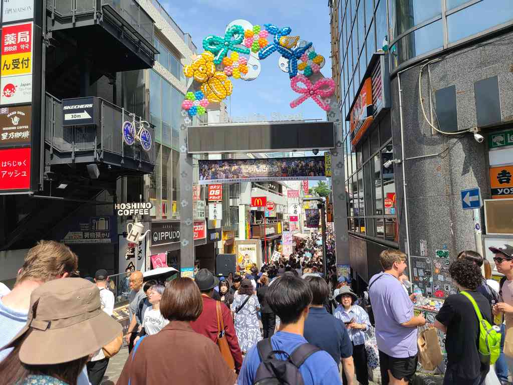 The famous Takeshita Street, right outside Harajuku station! Teenagers and tourists alike flock here for the wild cosplay and eclectic pop-culture shops.