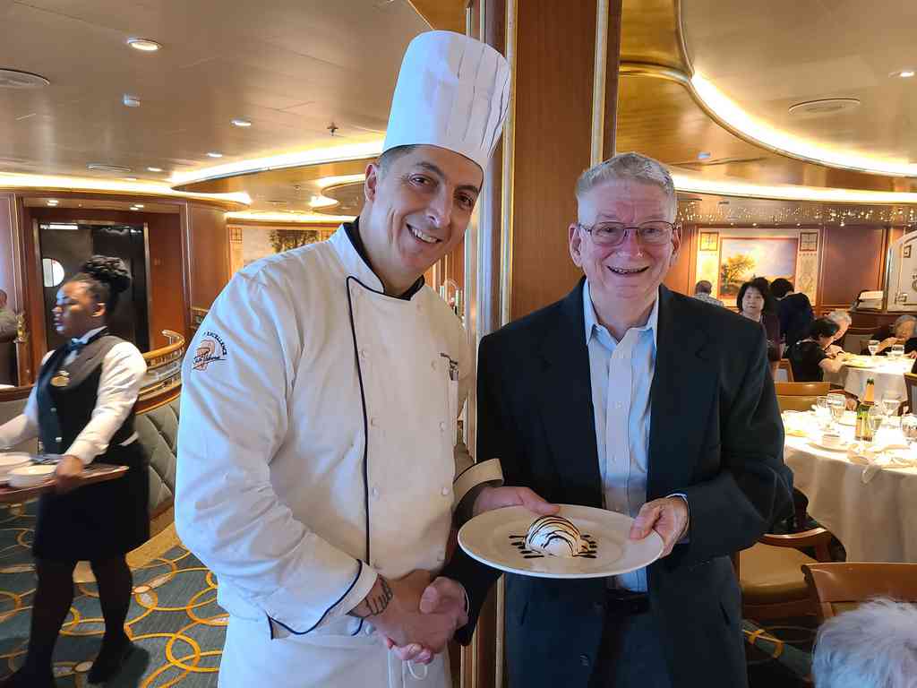 In the past, Princess served Baked Alaska every day during their Alaska cruises. On this trip, they weren't offering it, so Charles playfully asked the Sous chef, Riccardo, for one. Riccardo promised to deliver but never did. Charles then spoke with the Executive chef, and a beautiful Baked Alaska appeared the very next day! Of course, Riccardo still tried to take the credit for it!